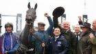 Energumene ridden by Paul Townend (left) after winning the Betway Queen Mother Champion Chase alongside owner Tony Bloom and trainer Willie Mullins  at Cheltenham.  Photograph: Steven Paston/PA Wire for the Jockey Club