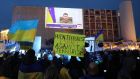 People watch Ukrainian president Volodymyr Zelenskiy’s speech which was broadcasted live at Habima square in Tel Aviv, Israel. Photograph: Abir Sultan/ EPA