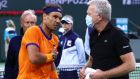 Rafael Nadal speaks to the ATP trainer Per Bastholt about his rib injury during the  semi-final at  Indian Wells. Photograph: Clive Brunskill/Getty Images