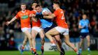 Rory Grugan and Niall Grimley of Armagh tackle Dublin’s Ciarán Kilkenny during the Allianz Football League Division One game at  Croke Park. Photograph: Ryan Byrne/Inpho