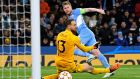 Manchester City’s Kevin De Bruyne shoots past Atlético Madrid goalkeeper Jan Oblak  in the Champions League quarter-final first leg at the Etihad Stadium. Photograph: Oli Scarff/AFP via Getty Images