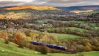 Travelling by rail is an ideal way to see the English countryside. Photograph: iStock