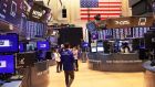  Traders work on the floor of the New York Stock Exchange. US stocks rose on Tuesday even in the face of surging Treasury yields as a positive earnings reports helped investors shrug off potential risks from an aggressive rise in US interest rates and the Ukraine war. 