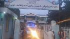 Taliban fighters and medical staff stand outside the gate of a hospital and prepare to attend to casualties after an explosion at the Imam Saheb district in Kunduz province. Photograph:  AFP