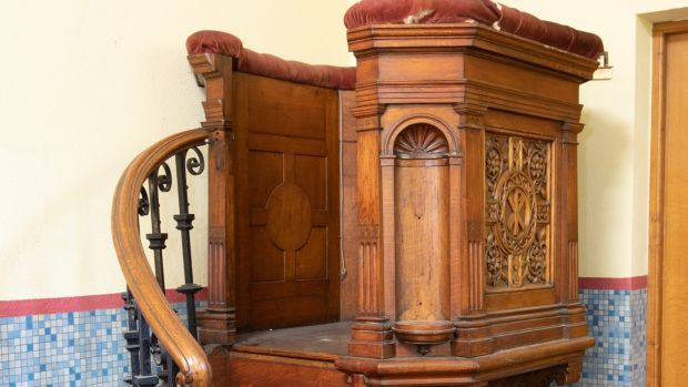 A 19th century oak pulpit with wrought iron balustrade, estimated at €800 - €1200.