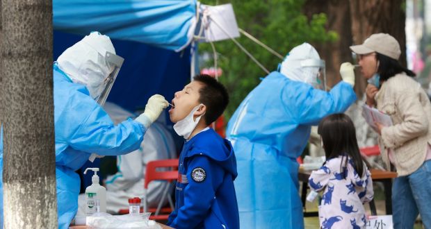  People undergo a swab test at a Covid-19  test site  in Beijing. China is trying to contain a worrying recent spike in coronavirus cases in the city. Photograph: Lintao Zhang/Getty Images