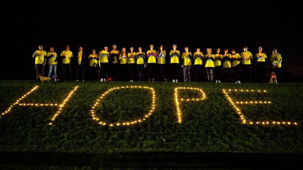 Prior to the walk, participants hold a candle at Malahide Castle in Co Dublin.  Photo: INPHO/Tom Maher