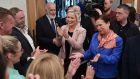  Sinn Féin’s  leader in Northern Ireland Michelle O’Neill (centre) and party president Mary Lou McDonald are seen with candidates and activists at the count centre on Saturday. Photograph: Getty 