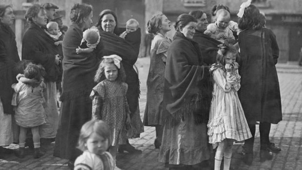 A group of Irish mothers and their children listening to speeches in Dublin during the 1922 Irish elections. Photograph: Daily Mirror/Mirrorpix/Mirrorpix via Getty