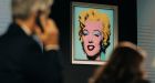 A 1964 Andy Warhol silk screen, Shot Sage Blue Marilyn, is auctioned at Christie’s on Monday in New York. Photograph: Jeenah Moon/The New York Times