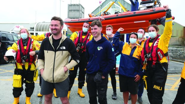 Patrick Oliver and his son Morgan, who rescued cousins Ellen Glynn and Sara Feeney off Inis Oírr island, on their arrival back at the Galway RNLI Lifeboat Station at Galway Docks. Photograph: Joe O’Shaughnessy