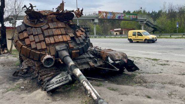 A destroyed Russian tank beside the main road leading west out of Kyiv. Photograph: Daniel McLaughlin