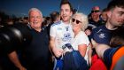 Monaghan’s Jack McCarron celebrates with his father Ray and mother Patricia after sending Dublin to Division Two with his late free. Photograph: James Crombie