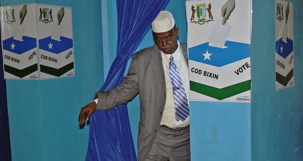 A  Somali MP exits a voting booth in Garowe in Somalia’s semi-autonomous Puntland region back in 2014.  The presidential election takes place  this  Sunday. Photograph: AFP via Getty 