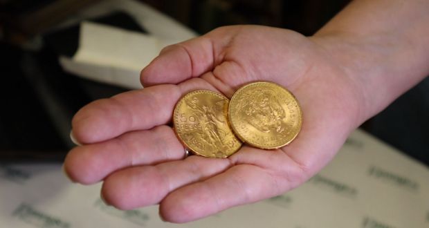 The solid gold coins are Mexican in origin. 