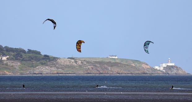  Kitesurfing off Dollymount, north Dublin, with Howth lighthouse in the background. Photograph Nick Bradshaw/The Irish Times