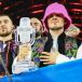 Members of the band Kalush Orchestra pose onstage with the winner’s trophy and Ukraine’s flags after winning on behalf of Ukraine the Eurovision Song contest at the Pala Alpitour venue in Turin. Photograph: Marco Bertorello/AFP/Getty