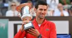 Serbia’s Novak Djokovic holds the winner’s trophy after winning the final match of the Italian Open. Photograph: Andreas Solaro/AFP via Getty