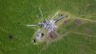 The remains of a Russian helicopter lie in a bomb-cratered field to the east of Kharkiv. Photograph: John Moore/Getty