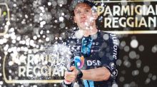 Team DSM’s Italian rider Alberto Dainese celebrates on the podium after winning the 11th stage of the Giro d’Italia. Photograph: Getty Images