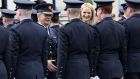 Garda Commissioner Drew Harris and Minister for Justice Helen McEntee congratulate new gardaí at the passing out ceremony in Templemore, Co Tipperary. Photograph : Laura Hutton / The Irish Times