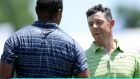 Tiger Woods  and Rory McIlroy shake hands after round at PGA Championship. Photograph:  Richard Heathcote/Getty