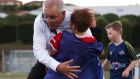 Prime minister Scott Morrison accidentally knocks over a child during a visit to the Devonport Strikers Soccer Club. Photograph: Asanka Ratnayake/Getty