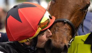Jockey Chris Hayes gives a kiss to Homeless Songs after their victory in the Tattersalls 1,000 Guineas at the Curragh. Photograph: Tom Maher/Inpho