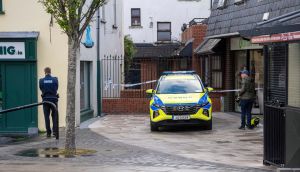 A garda outside the  Abbey Court apartment complex in Tralee where a man in his 50s died after sustaining serious injuries. Photograph: Domnick Walsh