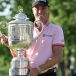 Justin Thomas poses with the Wanamaker Trophy after beating Will Zalatoris in a playoff. Photograph: Richard Heathcote/Getty Images