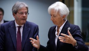 European commissioner for economy Paolo Gentiloni and ECB president Christine Lagarde speak at the start of the Eurogroup finance ministers meeting in Brussels on Monday. Photograph: Olivier Hoslet/EPA