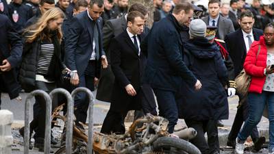 Macron urges talks solution after violence and looting in Paris