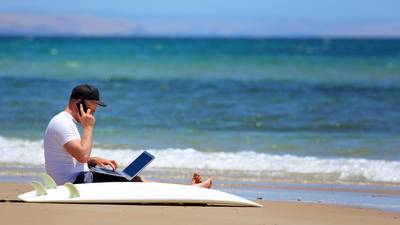 Want to move somewhere sunnier to remote work? Read the small print . . .