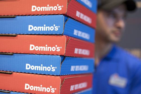 Domino’s Pizza warns over writedowns as it posts sales hike