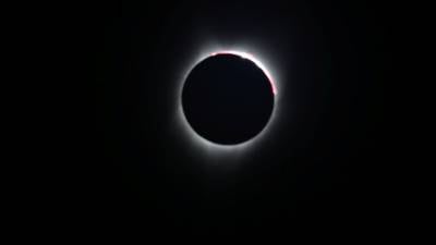 Total eclipse of the heartland: Millions scan the skies in US