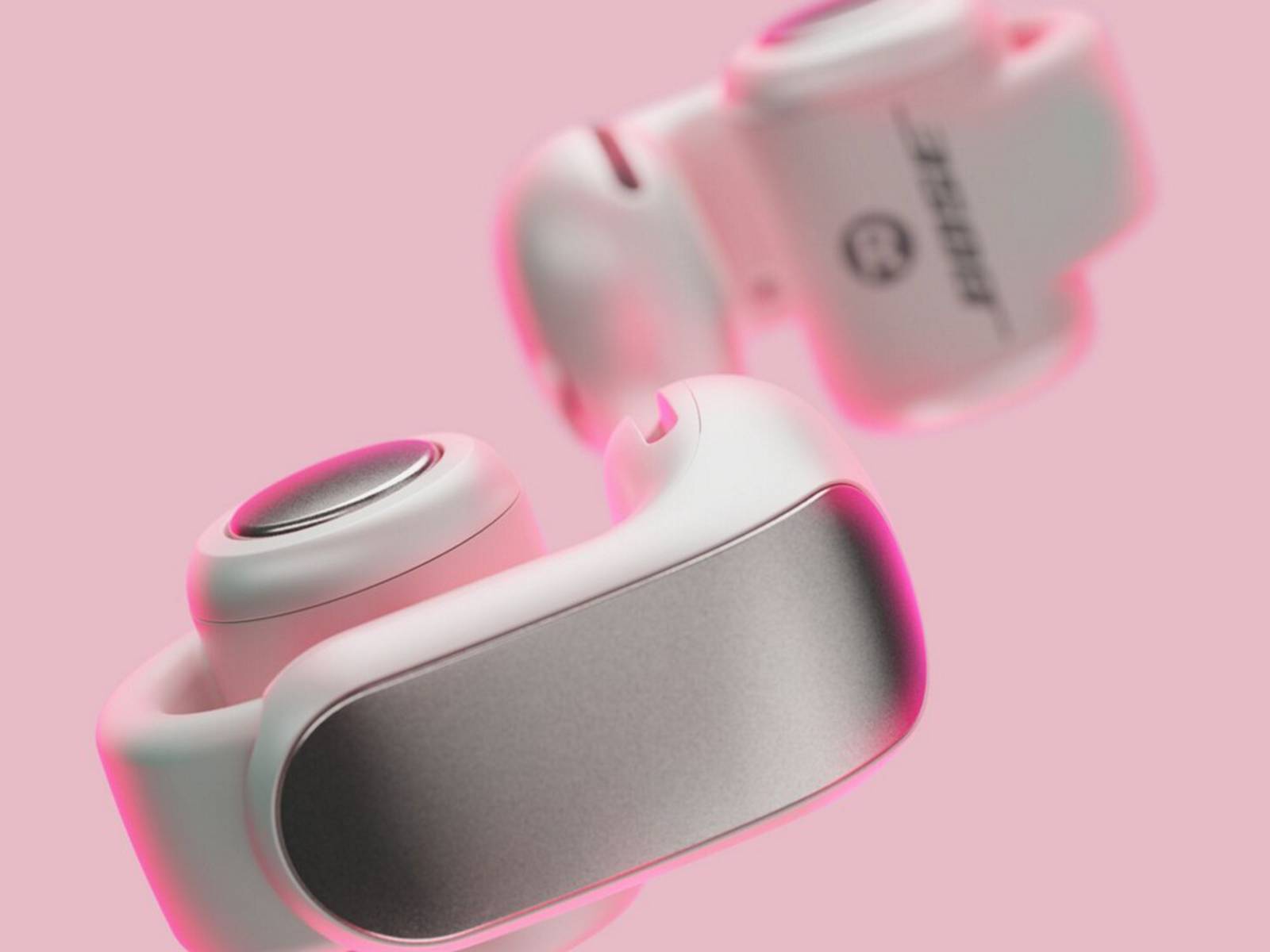 Cuff style ear buds, white buds on a pink background