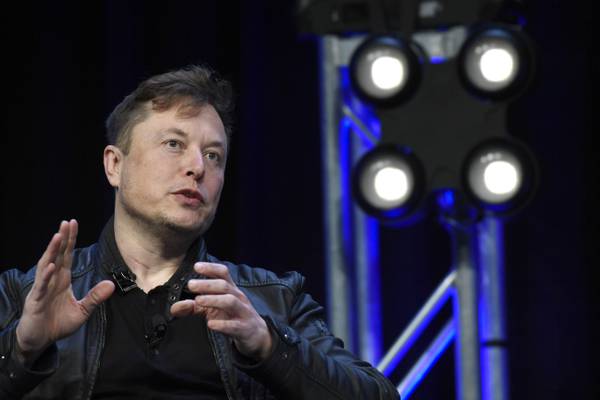 Elon Musk reveals humanoid robot prototype as Tesla plans to produce millions