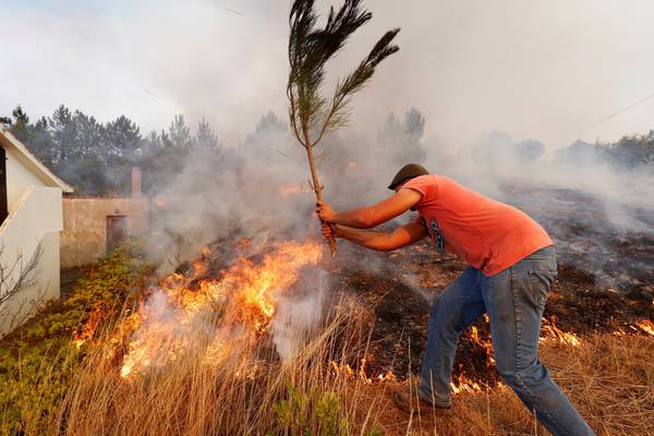 Portuguese wildfires under partial control but weather raises concerns
