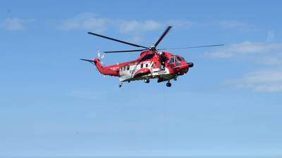 Volunteers abseil down embankment to rescue injured kayaker