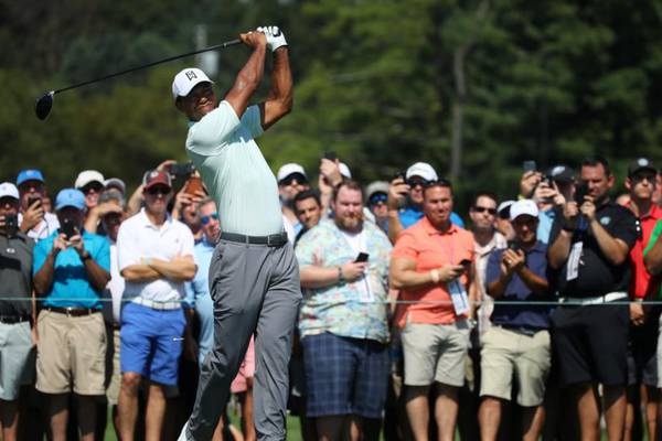 Rory McIlroy and Tiger Woods tied for the lead at BMW