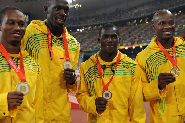 Usain Bolt stripped of 2008 Olympic gold after team-mate fails drugs test