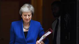 May hangs on as Brexiteers close in to sink her deal