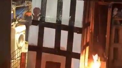 Police search house over Grenfell bonfire video