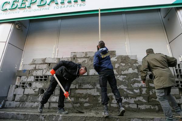 Russia denounces Ukraine's blockade and vows to defend banks