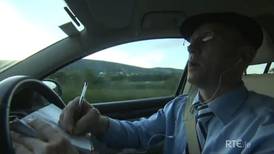 Shot of Healy-Rae  driving and on phone prompts warning to RTÉ