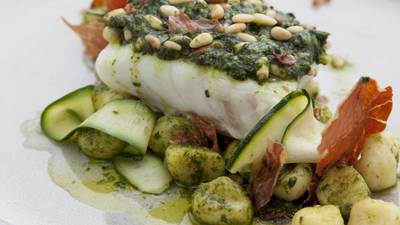 Baked fish with basil, pine nuts and prosciutto