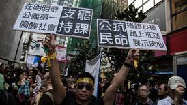 Activists march through Hong Kong in  protest at ‘backward democracy’