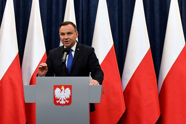 Poland’s president to sign Holocaust bill, defying critics