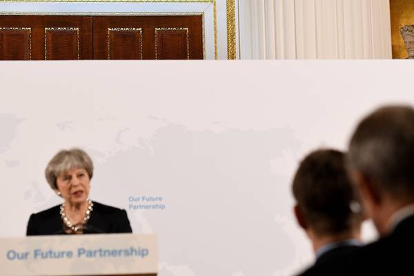 May vows to work with EU to avoid hard Irish Border