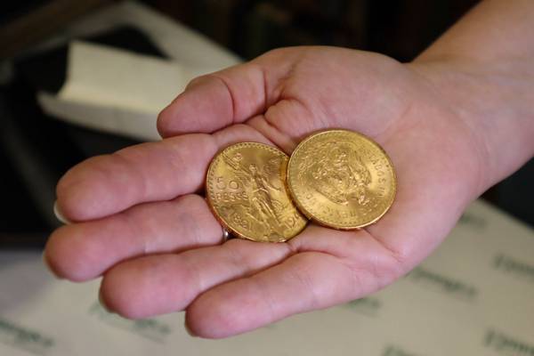 Solid gold coins worth €5,000 found in the cover of an old prayer book